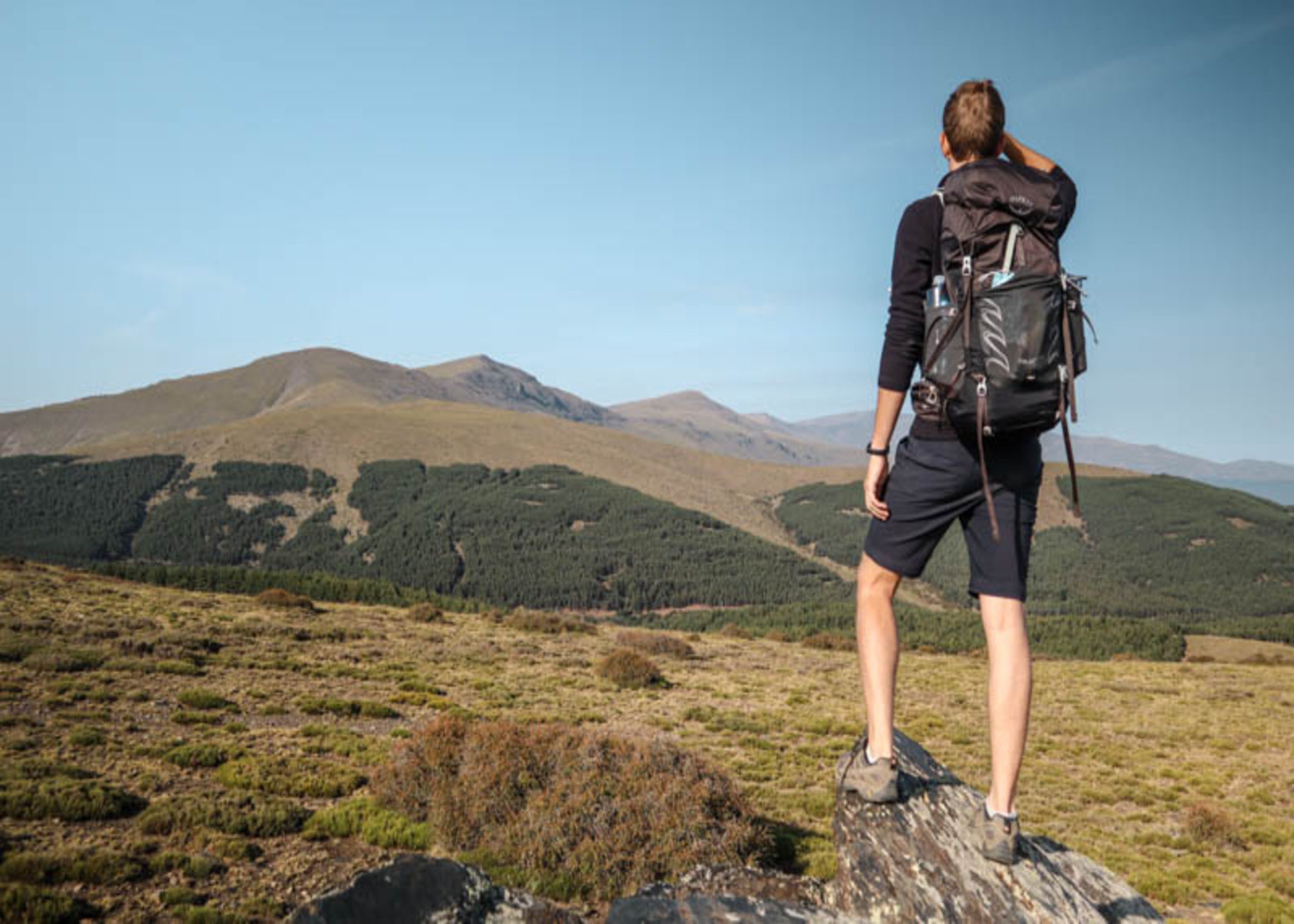 man-wearing-osprey-talon-44-backpack